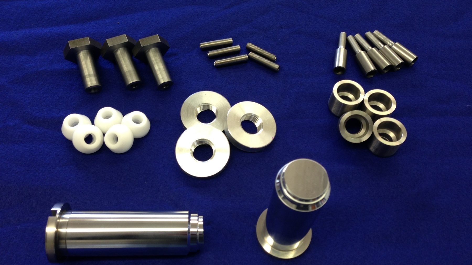 Machined steel pins, bushings, and spacers made by Empire Tool